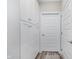 Hallway with ample storage in floor to ceiling cabinets and doors leading to other parts of the house at 622 Ehrlich Ln, Westfield, IN 46074