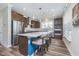 Modern kitchen featuring stainless steel appliances, a breakfast bar and wooden cabinets at 622 Ehrlich Ln, Westfield, IN 46074