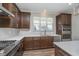 Functional kitchen featuring stainless appliances, tile backsplash, and ample counter space at 622 Ehrlich Ln, Westfield, IN 46074