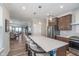 Spacious kitchen featuring a large island with seating, stainless steel appliances and open layout at 622 Ehrlich Ln, Westfield, IN 46074