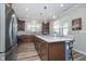 Well-equipped kitchen with stainless steel appliances and a large center island at 622 Ehrlich Ln, Westfield, IN 46074