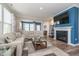 Cozy living room with fireplace, decorative shelving, and comfortable seating at 622 Ehrlich Ln, Westfield, IN 46074