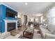 Bright living room with fireplace, adjacent to dining area and staircase at 622 Ehrlich Ln, Westfield, IN 46074