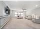 Bright living room with plush seating, a large TV, and modern design, creating a comfortable and stylish space at 622 Ehrlich Ln, Westfield, IN 46074