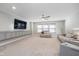 Spacious living room featuring a TV, comfortable seating, and ample natural light, perfect for entertainment and relaxation at 622 Ehrlich Ln, Westfield, IN 46074
