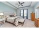 Spacious main bedroom featuring a trey ceiling, soft color palette, and windows that provide ample natural light at 622 Ehrlich Ln, Westfield, IN 46074
