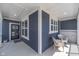 Inviting porch features seating area, providing a comfortable and stylish entrance at 622 Ehrlich Ln, Westfield, IN 46074