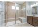 Elegant tile shower with glass door, bench, and window, creating a spa-like retreat in the bathroom at 622 Ehrlich Ln, Westfield, IN 46074