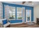 Bright sunroom with seating, backyard views, and natural light from many windows with patterned curtains at 622 Ehrlich Ln, Westfield, IN 46074