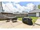 Relaxing backyard with hammock, patio set, grill and string lights at 64 Central Greens Blvd, Indianapolis, IN 46222