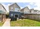 Spacious backyard with patio, grill, hammock, and well-maintained lawn at 64 Central Greens Blvd, Indianapolis, IN 46222