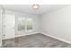 Bedroom with a door, window with blinds, gray carpet, and white walls at 64 Central Greens Blvd, Indianapolis, IN 46222