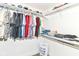 Walk-in closet featuring multiple shelves, racks, and hanging storage with a laundry basket at 64 Central Greens Blvd, Indianapolis, IN 46222