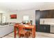Open concept kitchen and dining room featuring wood floors and modern decor at 64 Central Greens Blvd, Indianapolis, IN 46222