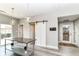 Bright kitchen area features a stylish barn door, stainless steel island, and access to the outdoor patio at 64 Central Greens Blvd, Indianapolis, IN 46222