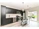 Sleek kitchen with stainless steel appliances, white countertops, and sliding glass doors at 64 Central Greens Blvd, Indianapolis, IN 46222