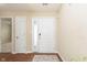 Bright foyer with hardwood floors and a view into the living room at 6467 W Whispering N Way, Greenfield, IN 46140