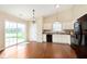Bright kitchen with modern appliances, white cabinetry and sliding glass doors to the backyard at 6467 W Whispering N Way, Greenfield, IN 46140