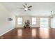 Bright living room featuring hard wood floors, a fireplace, and lots of natural light at 6467 W Whispering N Way, Greenfield, IN 46140