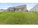 An ample, grassy, slightly sloping backyard featuring a chain-link fence at 6535 Heben Ct, Indianapolis, IN 46113