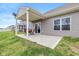 View of the backyard patio, with a dining set, siding, and sliding glass doors at 6535 Heben Ct, Indianapolis, IN 46113