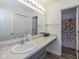 Bathroom with a large mirror, extended vanity, and decorative shower curtain at 6535 Heben Ct, Indianapolis, IN 46113