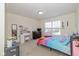 Bright bedroom with nice-sized window, furnishings, and decor at 6535 Heben Ct, Indianapolis, IN 46113