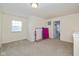 Neutral bedroom with natural light coming through window, and space for workout or fitness equipment at 6535 Heben Ct, Indianapolis, IN 46113