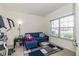 Cozy bedroom with a window, a blue couch, and an exercise machine at 6535 Heben Ct, Indianapolis, IN 46113