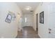 Bright hallway featuring modern flooring and neutral paint, leading to the main areas at 6535 Heben Ct, Indianapolis, IN 46113