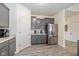 Well-equipped kitchen featuring modern appliances, gray cabinetry, and plenty of counter space at 6535 Heben Ct, Indianapolis, IN 46113