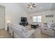 Cozy living room with plush seating, vaulted ceilings and ample natural light at 6535 Heben Ct, Indianapolis, IN 46113