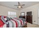 The main bedroom features ample space, a ceiling fan, and natural light at 6535 Heben Ct, Indianapolis, IN 46113