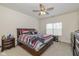 Spacious main bedroom featuring a ceiling fan, carpet, and a large window at 6535 Heben Ct, Indianapolis, IN 46113