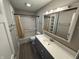 Updated bathroom featuring a modern vanity and shower-tub combo at 6672 E 225 S, Whitestown, IN 46075