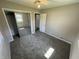 This bedroom features neutral walls, carpet and closet with mirrored doors at 6672 E 225 S, Whitestown, IN 46075