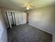 A cozy bedroom featuring plush carpeting, neutral paint, and double-door closets at 6672 E 225 S, Whitestown, IN 46075