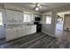 Well-lit kitchen with white cabinets and modern appliances at 6672 E 225 S, Whitestown, IN 46075