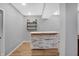 Basement bar area featuring custom wood counterspace and shelving for storing bar supplies at 6869 W Winding, McCordsville, IN 46055