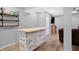 Basement bar featuring custom wood counterspace with barstools and shelving at 6869 W Winding, McCordsville, IN 46055