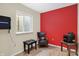 Finished basement with a red accent wall, seating, and a window at 6869 W Winding, McCordsville, IN 46055