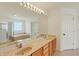 Bathroom features double sinks with a large mirror and recessed lighting at 6869 W Winding, McCordsville, IN 46055