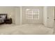Cozy bedroom with a large window, neutral carpet, and ample natural light at 6869 W Winding, McCordsville, IN 46055