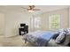 Bright bedroom with large windows and a comfortable bed with patterned bedding at 6869 W Winding, McCordsville, IN 46055