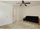 Neutral bedroom with a black futon, ceiling fan and a window with natural light at 6869 W Winding, McCordsville, IN 46055