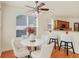 Cozy breakfast nook with a modern fan, breakfast bar, and stylish seating at 6869 W Winding, McCordsville, IN 46055