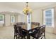 Bright dining area boasting neutral finishes, a chandelier, and lots of natural light at 6869 W Winding, McCordsville, IN 46055