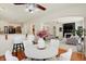 Open-concept dining and living room with hardwood floors and modern finishes provide comfortable living at 6869 W Winding, McCordsville, IN 46055