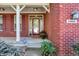 Inviting front porch with red brick and decorative columns for a classic touch at 6869 W Winding, McCordsville, IN 46055