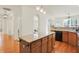 Spacious kitchen featuring a large island with stone countertops and modern lighting at 6869 W Winding, McCordsville, IN 46055